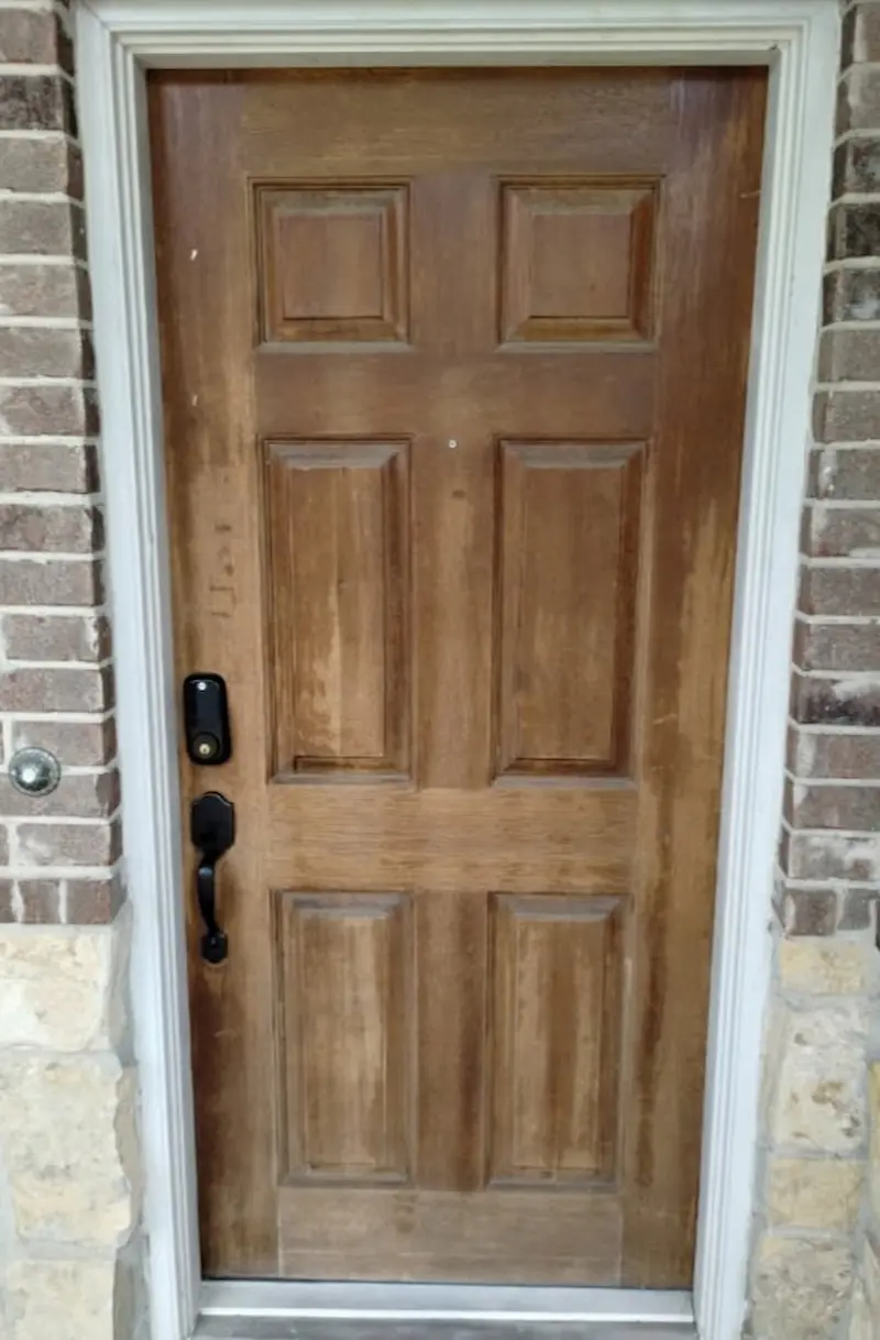 Weathered oak front door before refinishing