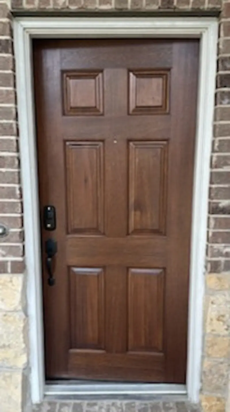 Restored oak front door after refinishing